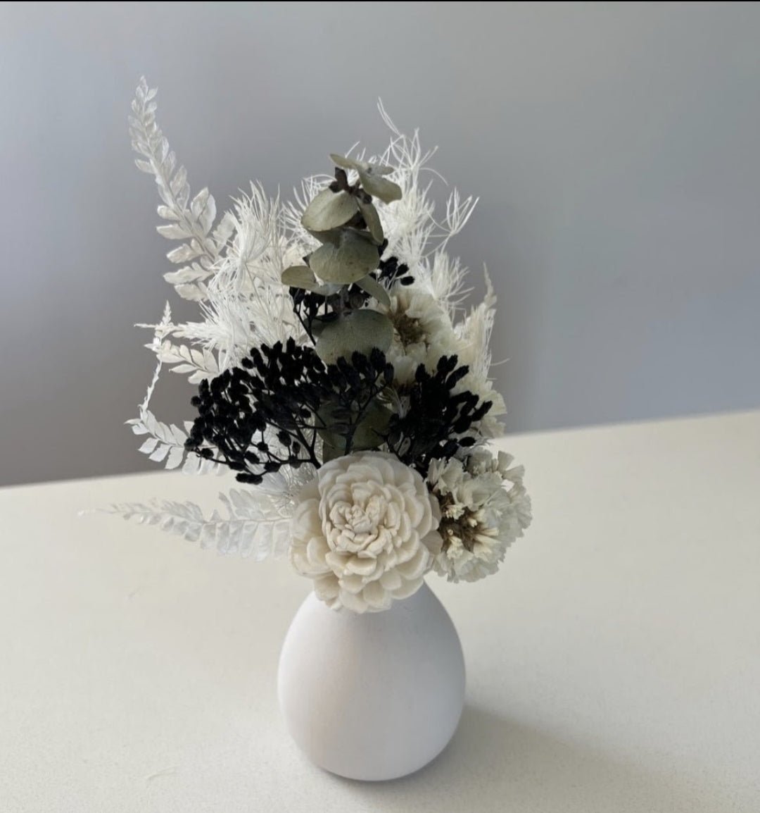 Dried floral arrangement in vase - Exquisite Laser Clinic